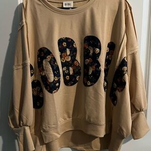 BiBi Tan Sweatshirt with Floral Lettering “gobble” very oversized